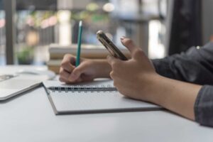 woman-hands-with-pen-writing-on-notebook-in-the-of-2023-03-08-18-39-31-utc